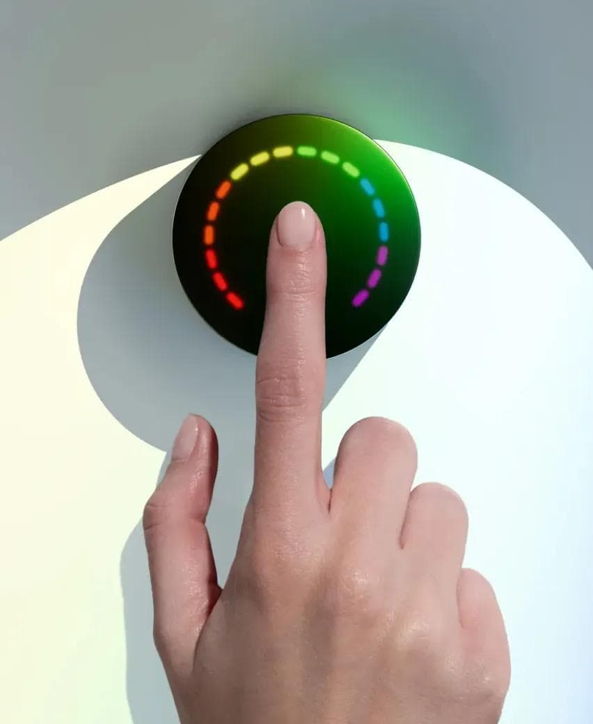 A finger placed on the Prysm iO device during a 15-second wellness scan